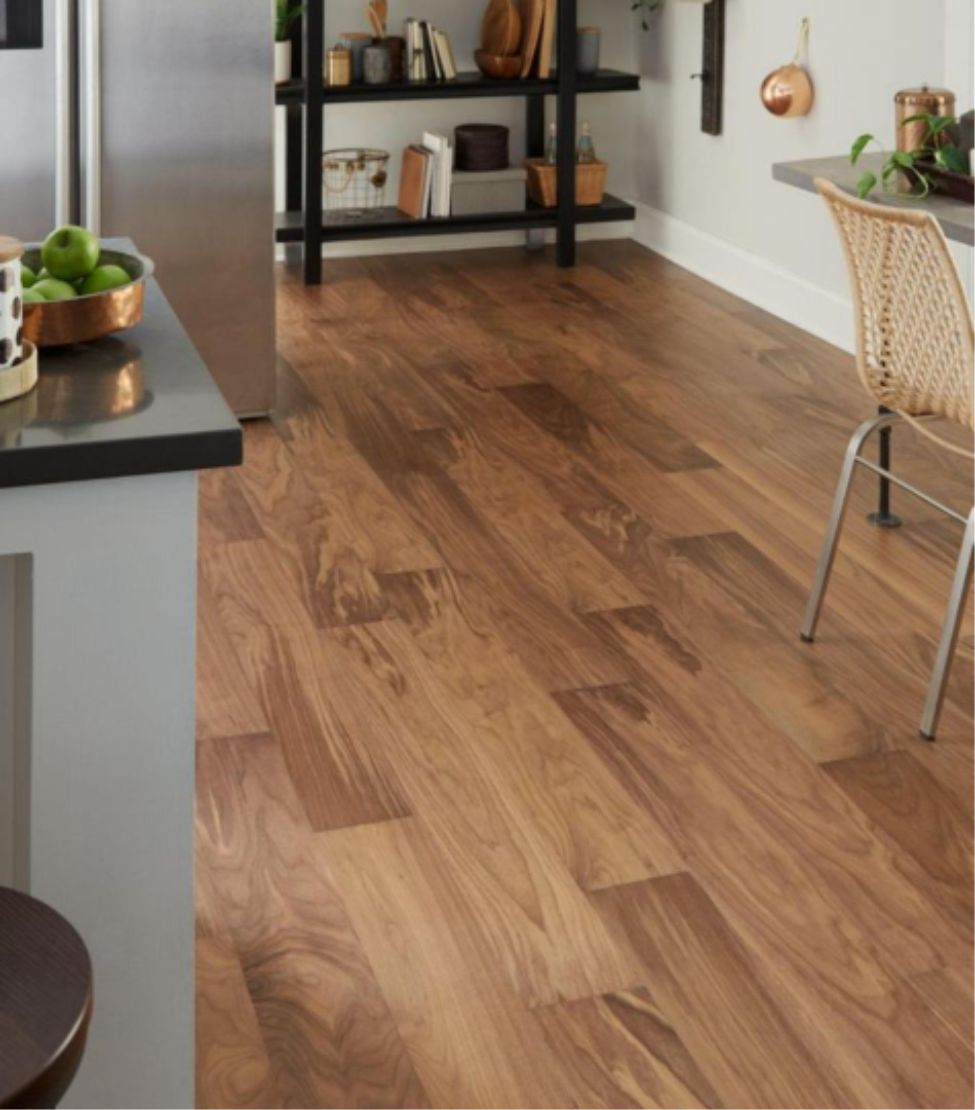 Light laminate planks laid across a bright interior
