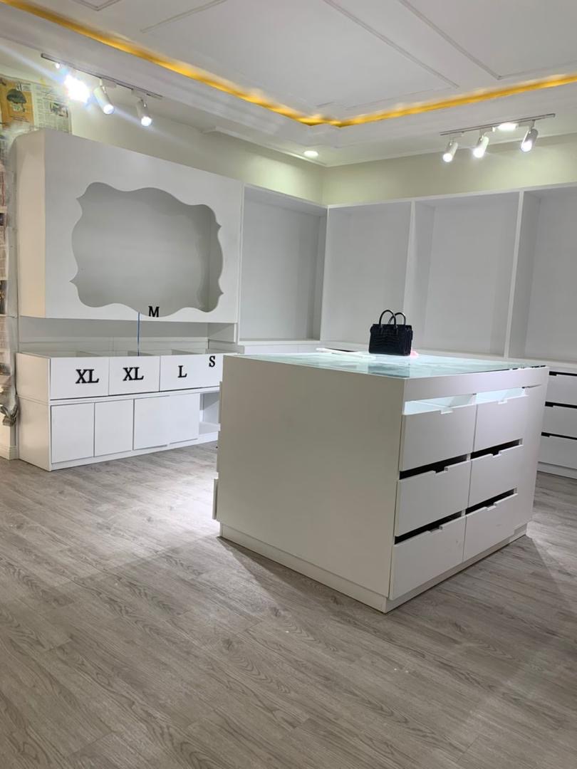 Grey wood-effect flooring in a completed retail fit-out